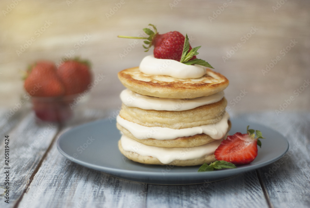 Dessert Pancakes with Cream and Strawbery. Health Breakfast Fruit Berry Vitamine Gray Rustic Wooden Background Dessert Pancakes with Cream and Strawbery. Health Breakfast Fruit Berry Vitamine Gray Rustic Wooden Background