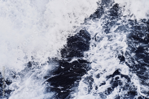 Background shot of aqua sea water surface. Aqua texture background.