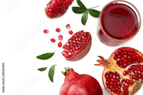 Pomegranate juice with pomegranate isolated on a white background top view