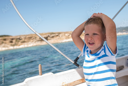 Portrait of caucasian child boy on jacht