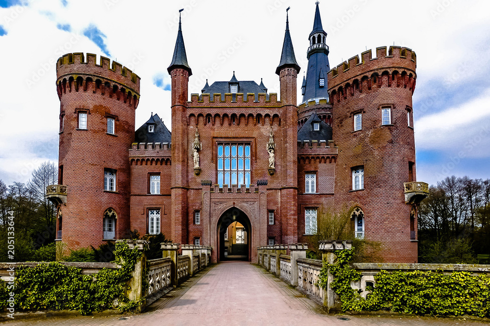 ccess road over the bridge towards Moyland Castle in Germany
