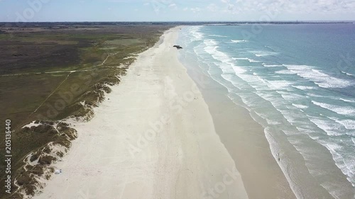 Wide aerial, empty beach in France