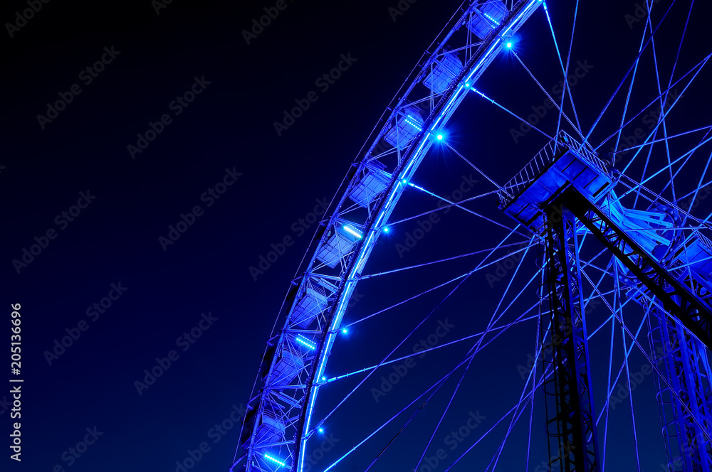 Fototapeta premium Big ferris wheel with festive blue illumination