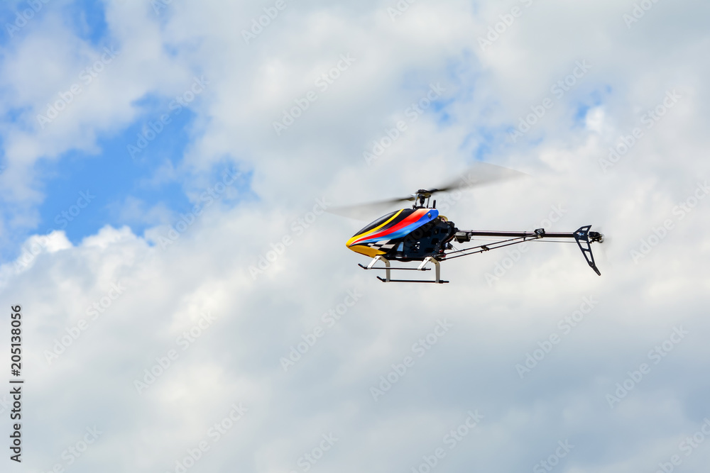 Homemade radio control helicopter on blue sky. Homemade radio control helicopter on blue sky.