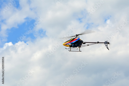 Fototapeta Naklejka Na Ścianę i Meble -  Homemade radio control helicopter on blue sky.