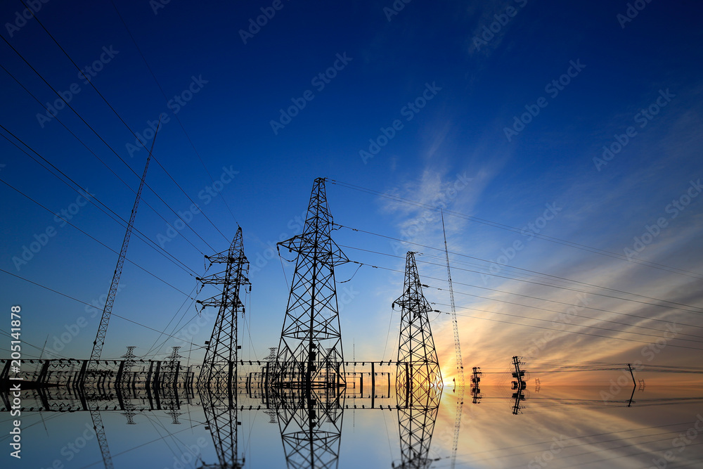 A high voltage substation in the sky at sunrise