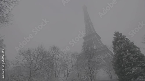 Low angle, Eiffel Tower during snowstorm