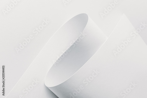 Close-up view of white rolled paper on white background