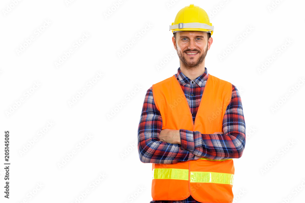 Young handsome bearded man construction worker