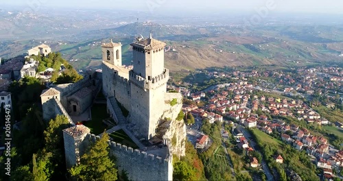 Old castle, C4k aerial rising tilt view of Guaita fortress, on a sunny autumn day, in San Marino city photo