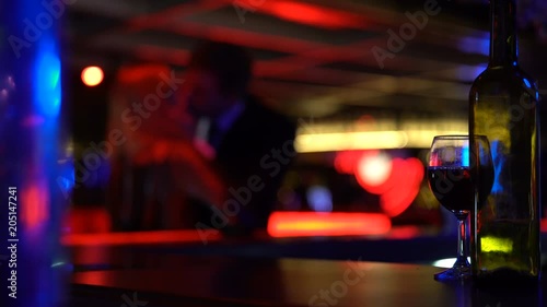 Businessman kisses lady heartily at meeting, lovers dating secretly in nightclub