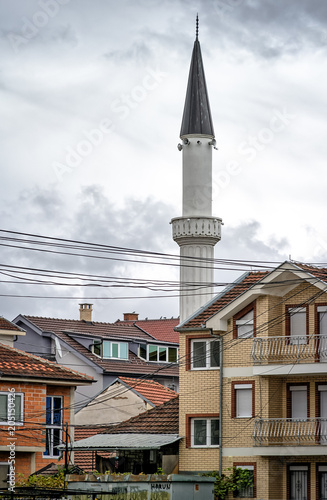 Minaret of Sulejman Arap Mosque amongst Houses - Tower with Loudspeakers for Muslim Call to Prayer - Struga, FYROM Macedonia, Balkans. Islamic Adhan photo