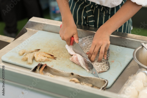 fresh fish cutting and prepare to cook by chef in a cooking class