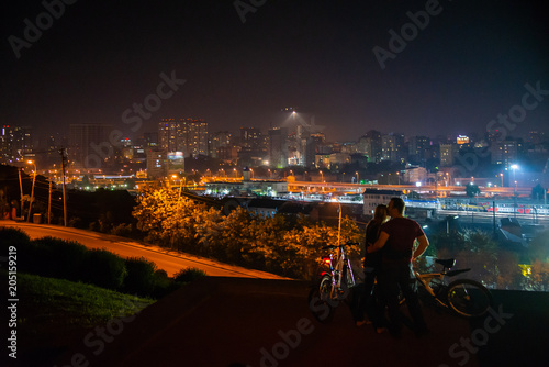 Couple in love with the panorama of the night city