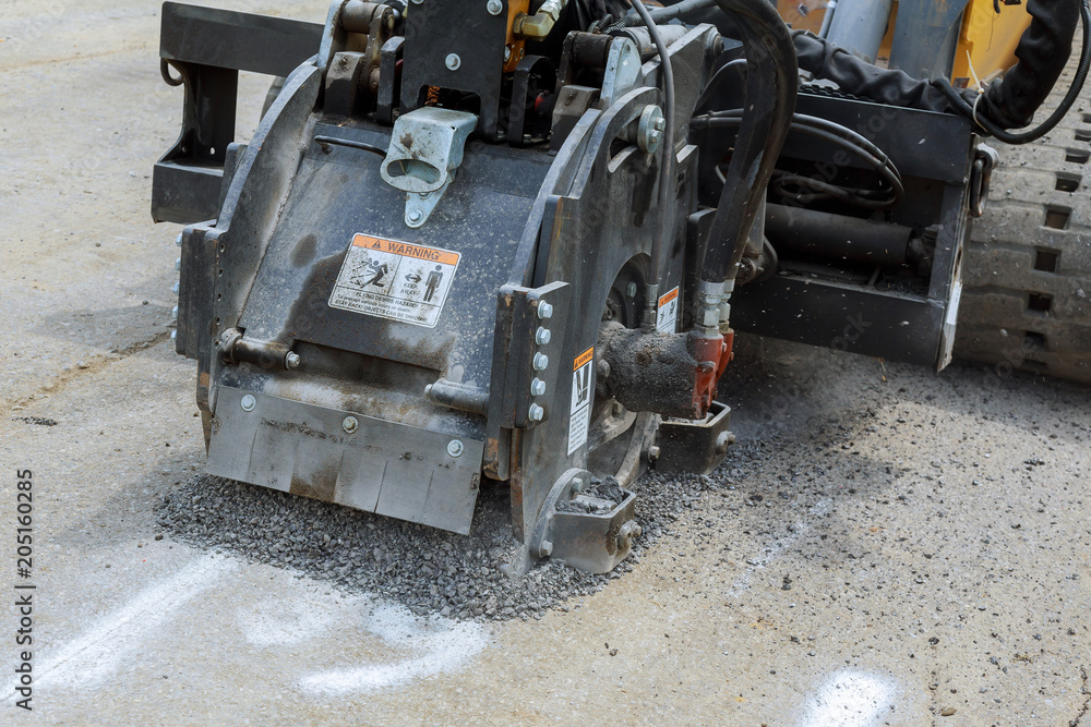 Milling of asphalt for road reconstruction accessory for skid steer Milling of asphalt for road reconstruction accessory for skid steer