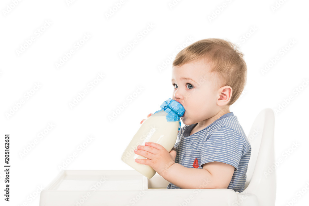 baby boy with bottle of milk and sitting highchair isolated on white background baby boy with bottle of milk and sitting highchair isolated on white background