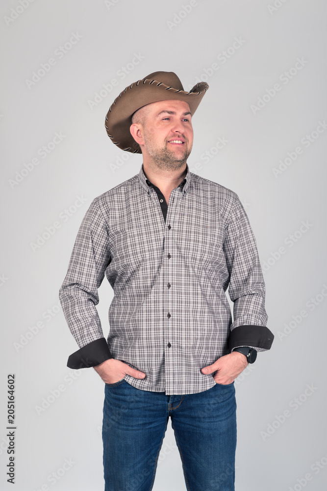 The man's portrait in a cowboy's hat. The man's portrait in a cowboy's hat.