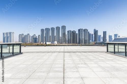 Panoramic skyline and buildings with empty concrete square floor，chongqing city，china