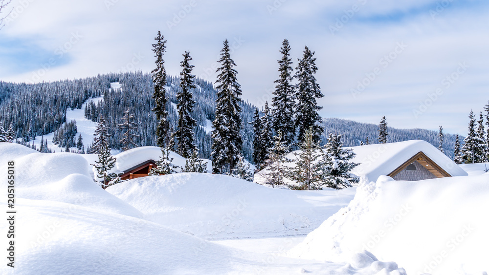 Deep snow pack covering houses and roads of the alpine village of Sun Peaks in the Shuswap Highlands of central British Columbia, Canada Deep snow pack covering houses and roads of the alpine village of Sun Peaks in the Shuswap Highlands of central British Columbia, Canada