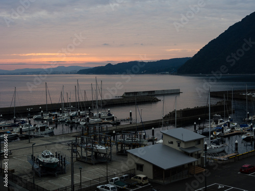 Beppu, Japan - October 31, 2016: Sunset over Kitahama Yacht Harbor at Beppu port photo