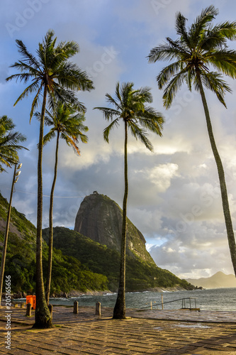 Sunsire at Praia Vermelha (Vermelha beach) with Pao de Acucar (Sugar Loaf Mountain) on the background. Rio de Janeiro, Urca, Brazil
