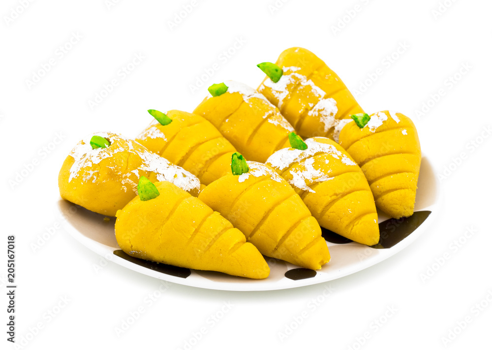 Indian Sweet Food Mango Mawa Pedha or Peda isolated on White Background