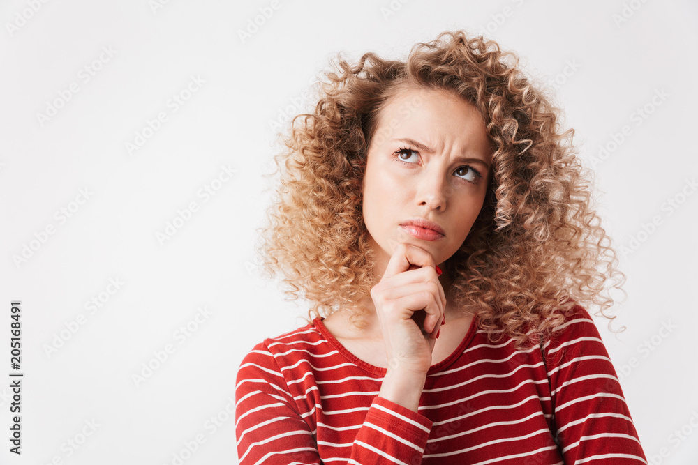 Pensive serious blonde curly woman in casual clothes Pensive serious blonde curly woman in casual clothes