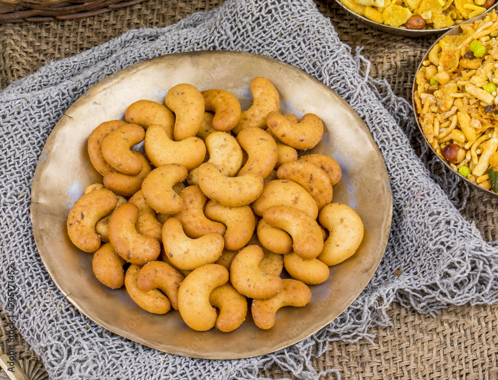 Salted Flavor Roasted Cashew Nut Snacks Served in Plate Also Know as in India Kaju Namkeen or Masala Kaju on Vintage Background Salted Flavor Roasted Cashew Nut Snacks Served in Plate Also Know as in India Kaju Namkeen or Masala Kaju on Vintage Background