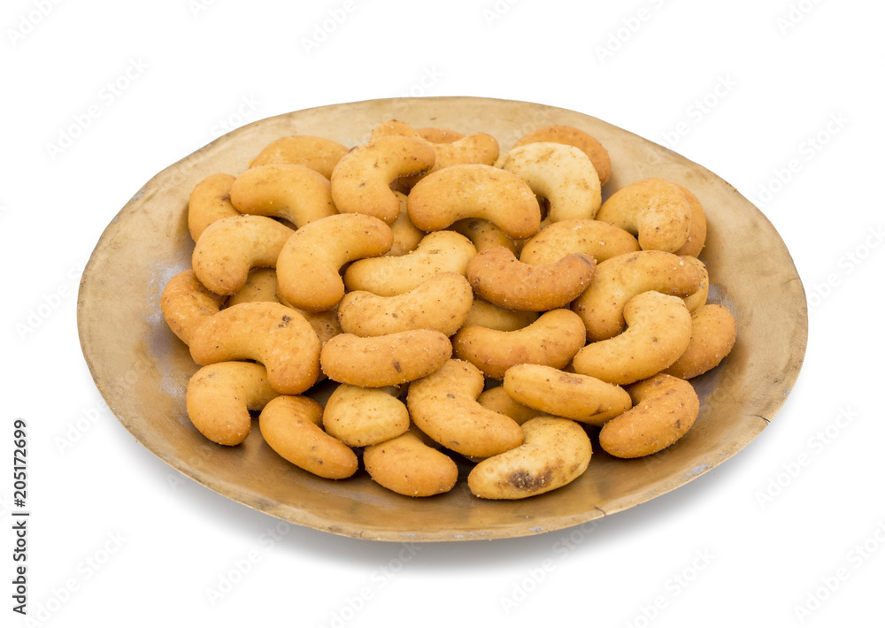 Salted Flavor Roasted Cashew Nut Snacks Served in Plate Also Know as in India Kaju Namkeen or Masala Kaju isolated on White Background Salted Flavor Roasted Cashew Nut Snacks Served in Plate Also Know as in India Kaju Namkeen or Masala Kaju isolated on White Background