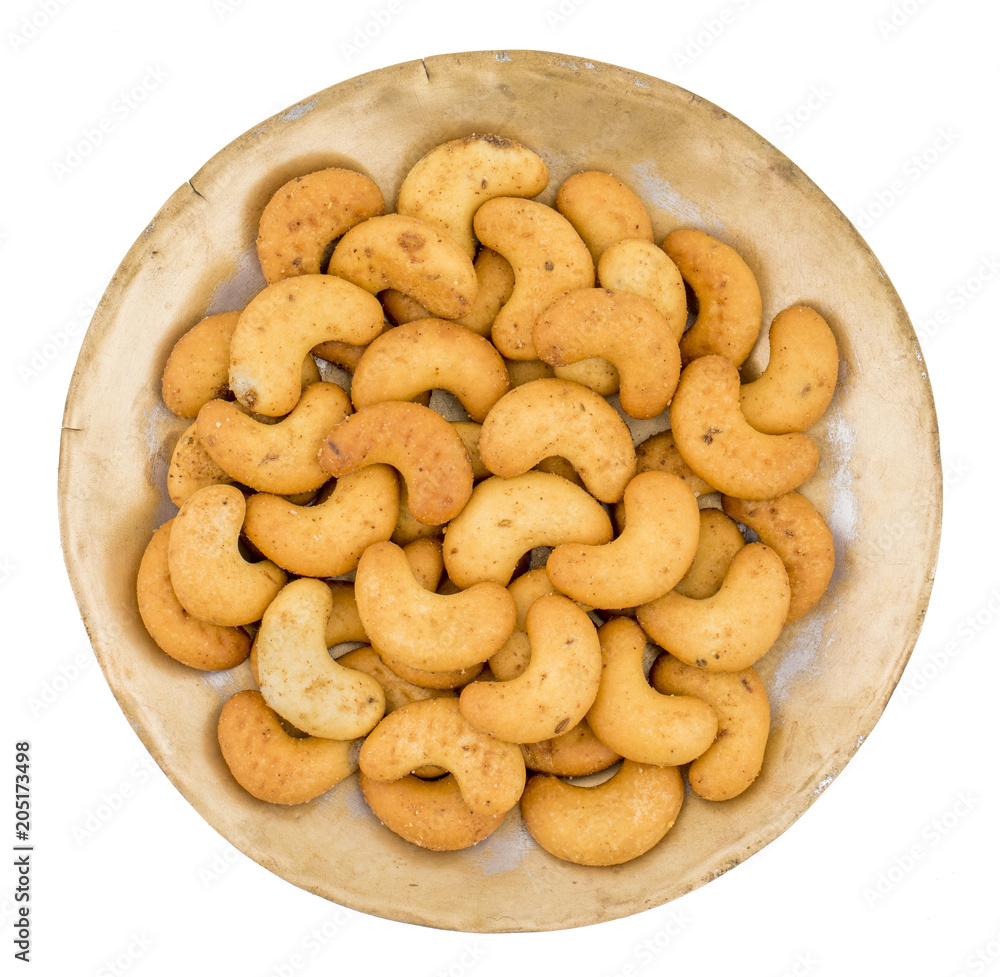 Salted Flavor Roasted Cashew Nut Snacks Served in Plate Also Know as in India Kaju Namkeen or Masala Kaju isolated on White Background