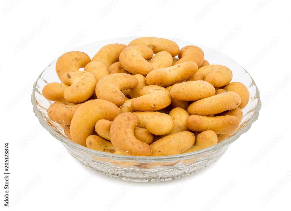 Salted Flavor Roasted Cashew Nut Snacks Served in Glass Bowl Also Know as in India Kaju Namkeen or Masala Kaju isolated on White Background Salted Flavor Roasted Cashew Nut Snacks Served in Glass Bowl Also Know as in India Kaju Namkeen or Masala Kaju isolated on White Background