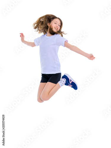 A teenage girl is jumping