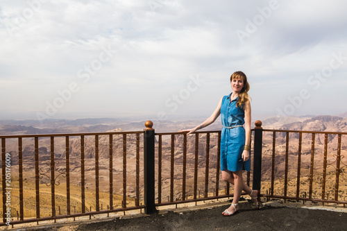 Female tourist on the place for seeing beatiful view of mountain
