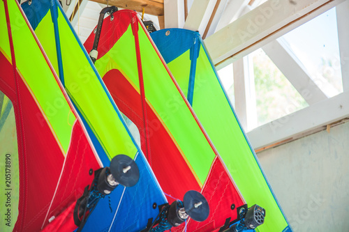 Different sails for the windsurf hang in the barn