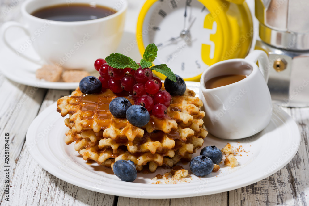 waffles with berries and caramel for breakfast, closeup waffles with berries and caramel for breakfast, closeup