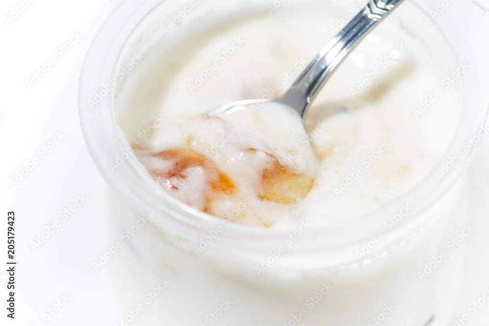 yoghurt in a jar with peach, closeup yoghurt in a jar with peach, closeup