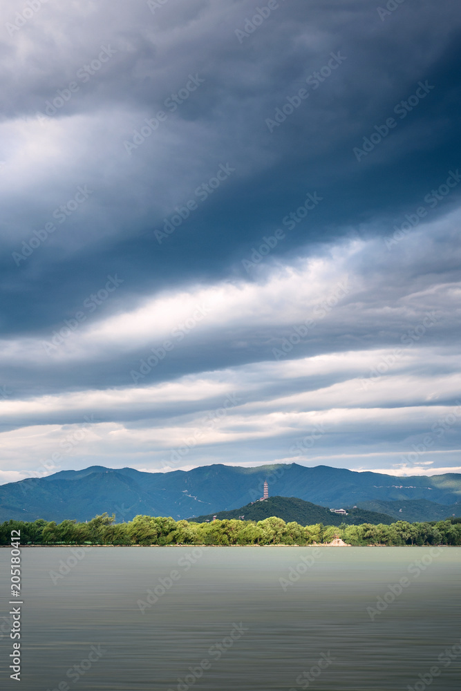 Fototapeta premium Sunrise with blue sea and dramatic stormy sky.
