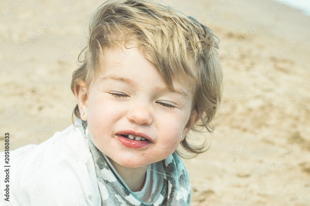 Portrait of a lovely little girl on the beach Portrait of a lovely little girl on the beach
