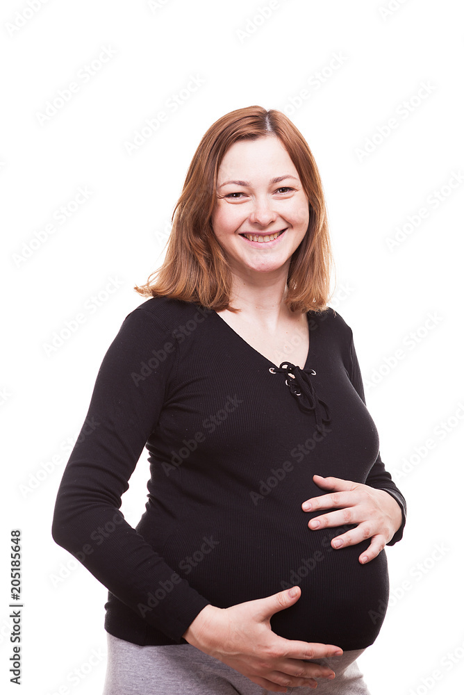 Smiling pregnant woman isolated over white background in studio photo Smiling pregnant woman isolated over white background in studio photo