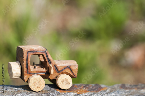 SUV toy car in nature / Wooden SUV, toy car in an extreme landscape.