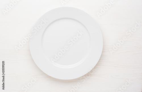 empty white plate on white background top view