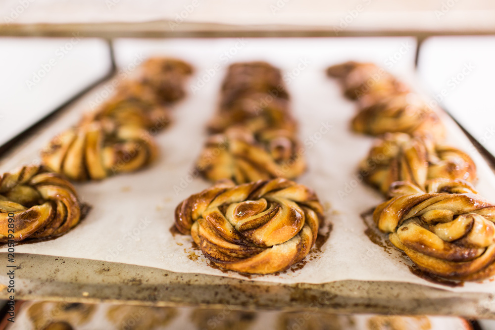 Organic Cinnamon Buns closeup on rack bakery Organic Cinnamon Buns closeup on rack bakery