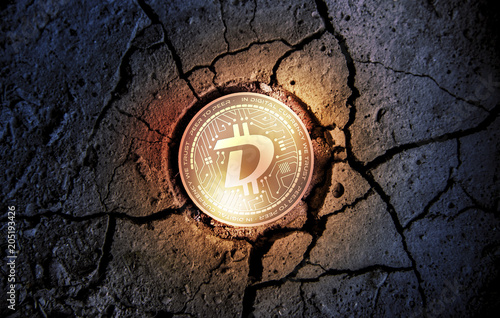 shiny golden DIGIBYTE cryptocurrency coin on dry earth dessert background mining