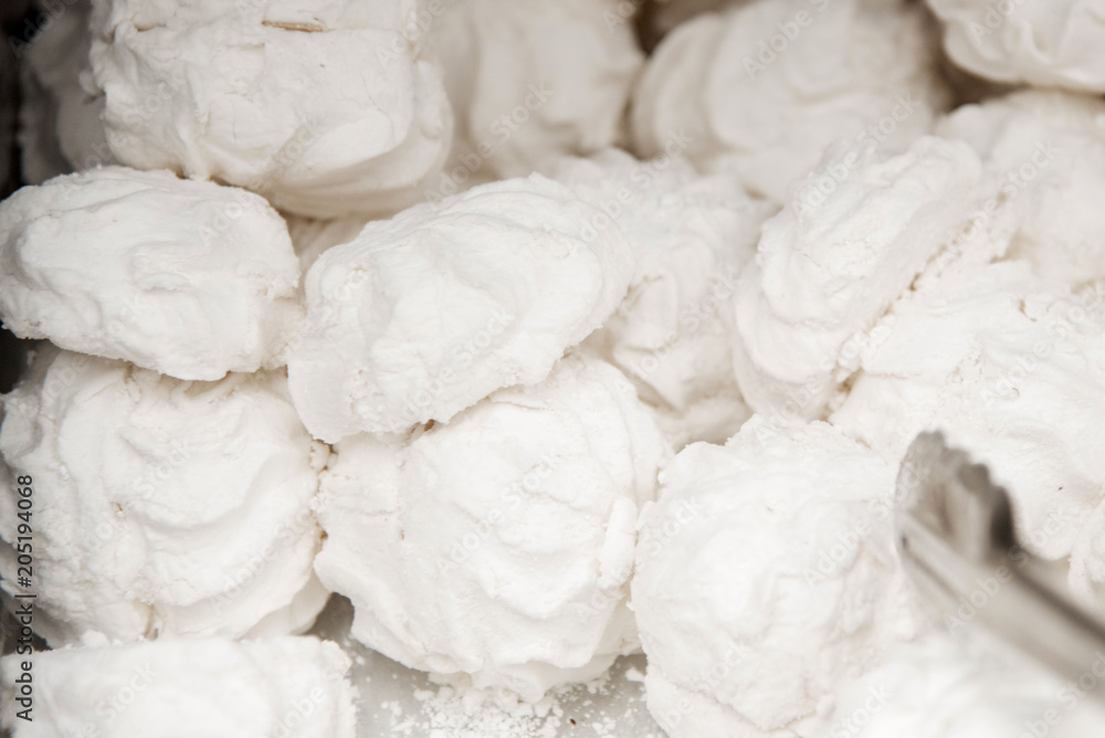 Marshmallows on a shelf in a supermarket. Lots of round marshmallows. Soft focus Marshmallows on a shelf in a supermarket. Lots of round marshmallows. Soft focus