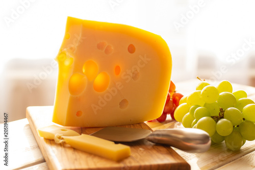 Dutch hard cheese Maasdam or Emmentaler, cheese with holes