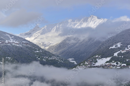 view on clouds and peak mountain covered with snow 