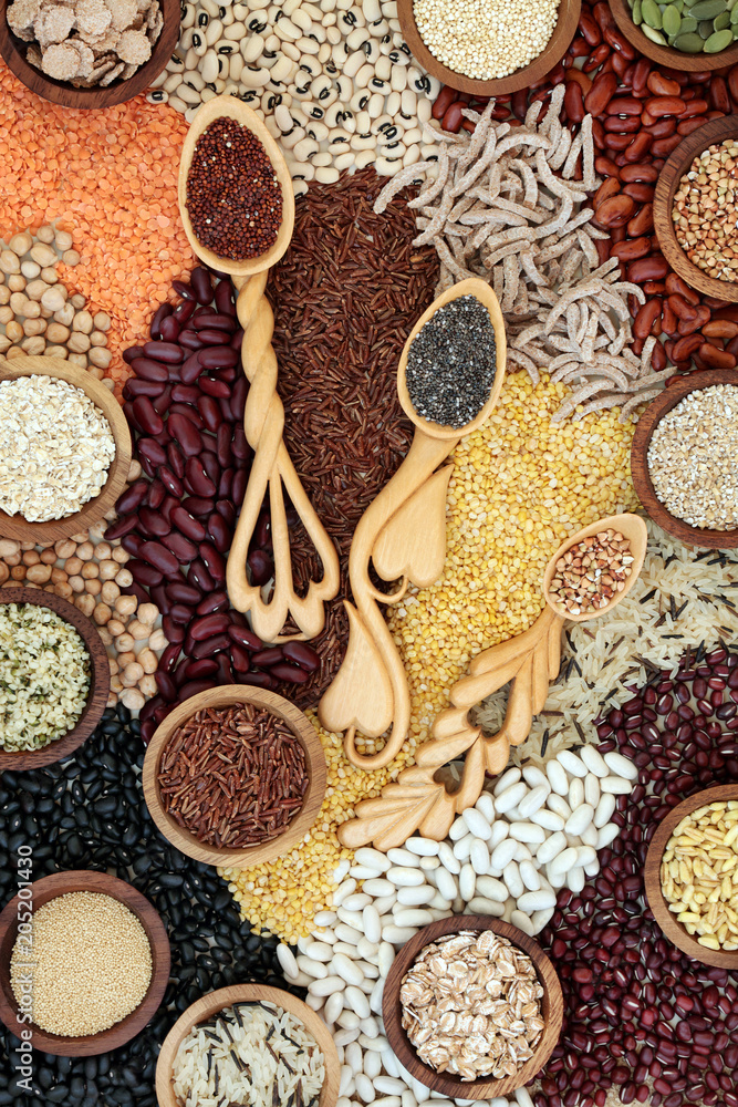 Dried super food background with grains, seeds, pulses & cereals loose