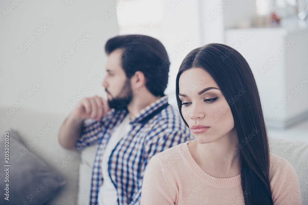 Portrait of upset couple having conflict unhappy girl sitting ignore her boyfriend after scandal they do not speak with each other having distrust disrespect negative emotions Portrait of upset couple having conflict unhappy girl sitting ignore her boyfriend after scandal they do not speak with each other having distrust disrespect negative emotions