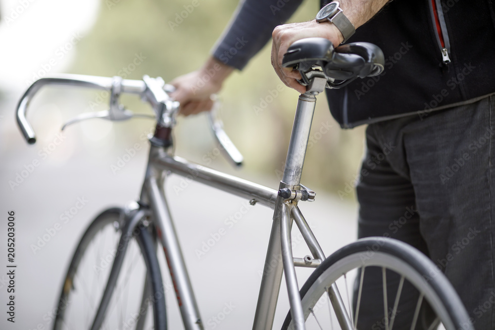 Obraz premium Man Holding Bike
