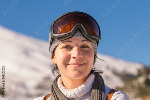 Beautiful woman's portrait with ski sunglasses.